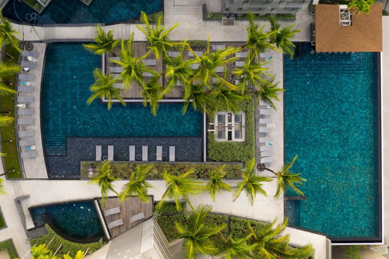 Oceanfront Beach Resort - Sha Extra Plus Patong Exterior foto Aerial view of the pool at the hotel