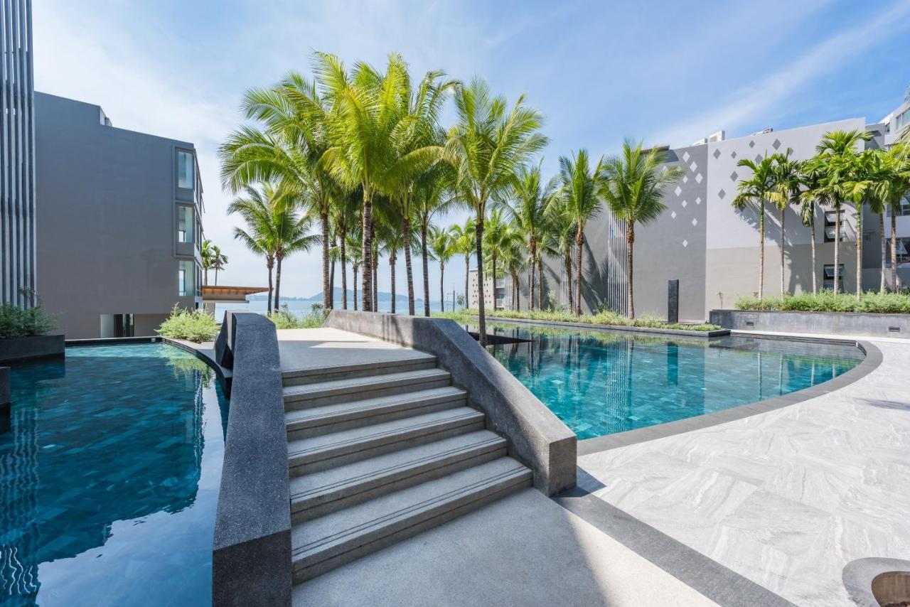 Oceanfront Beach Resort - Sha Extra Plus Patong Exterior foto The swimming pool at the resort